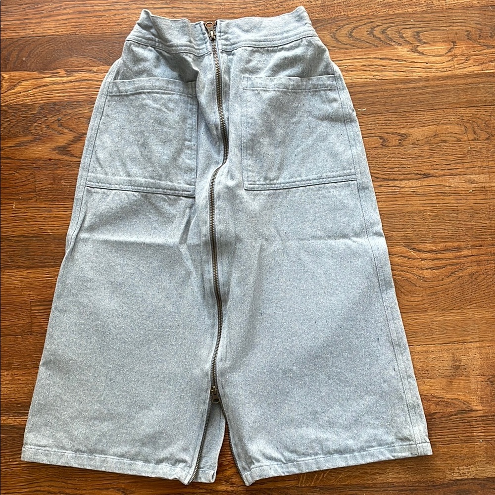 Noble Denim Skirt in S 
Runs Small IMO
Back pocket and slit 
Front zipper